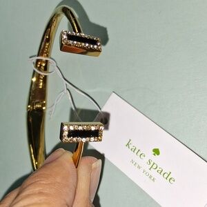 Elegant Gold Bracelet with Black Riasing The Bar